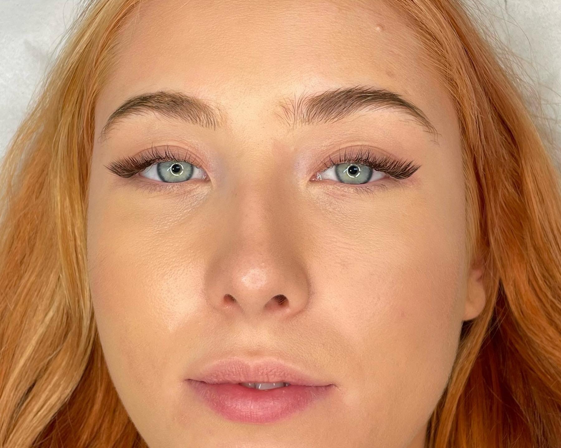 Cat-eye volume lash extensions with shaped, softly filled brows