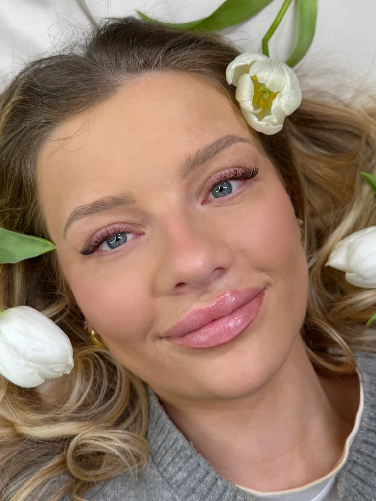 Hybrid volume lash extensions with a soft open-eye curl, paired with shaped and tinted brows