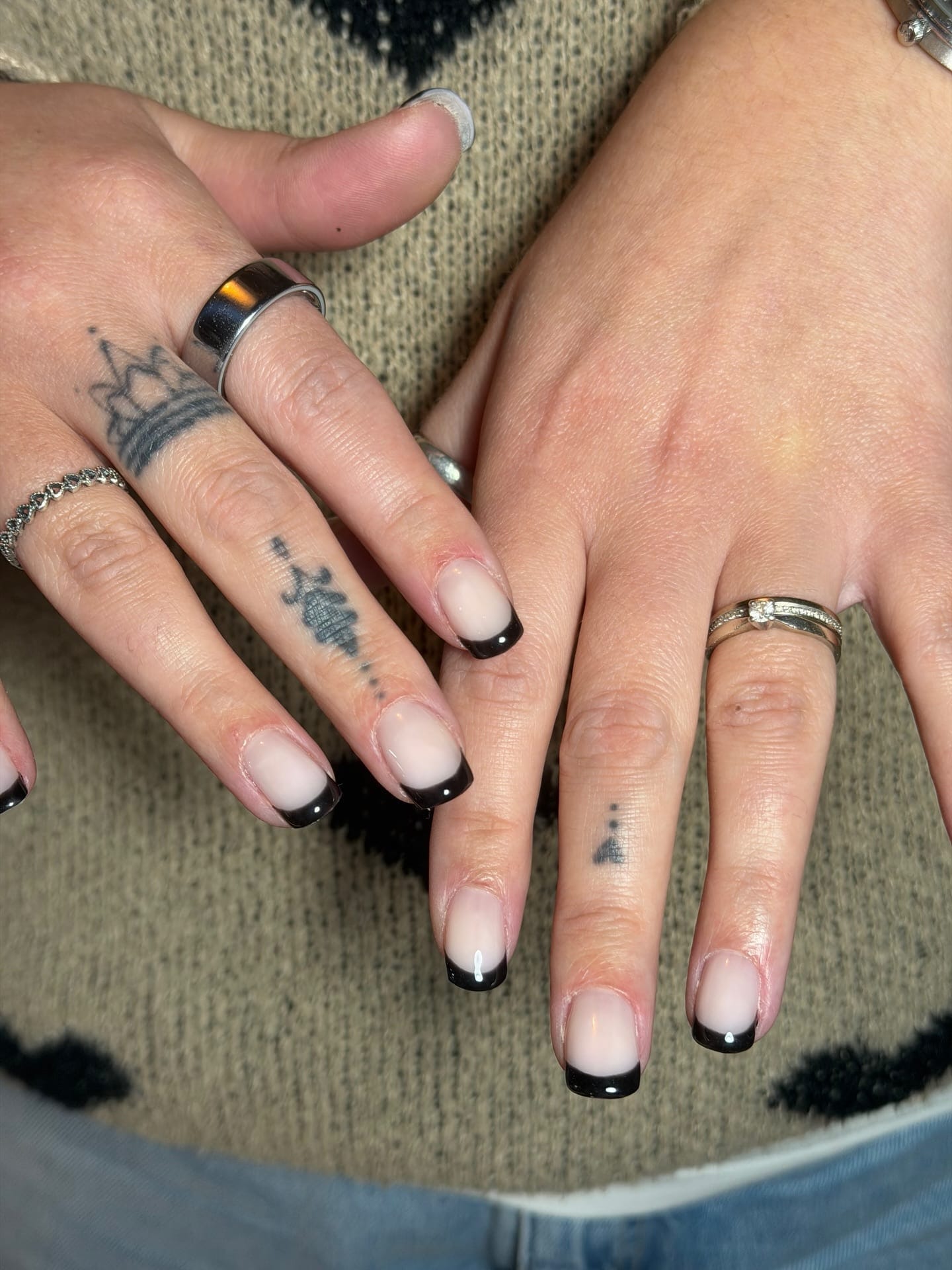 Black French tip gel manicure on medium square nails