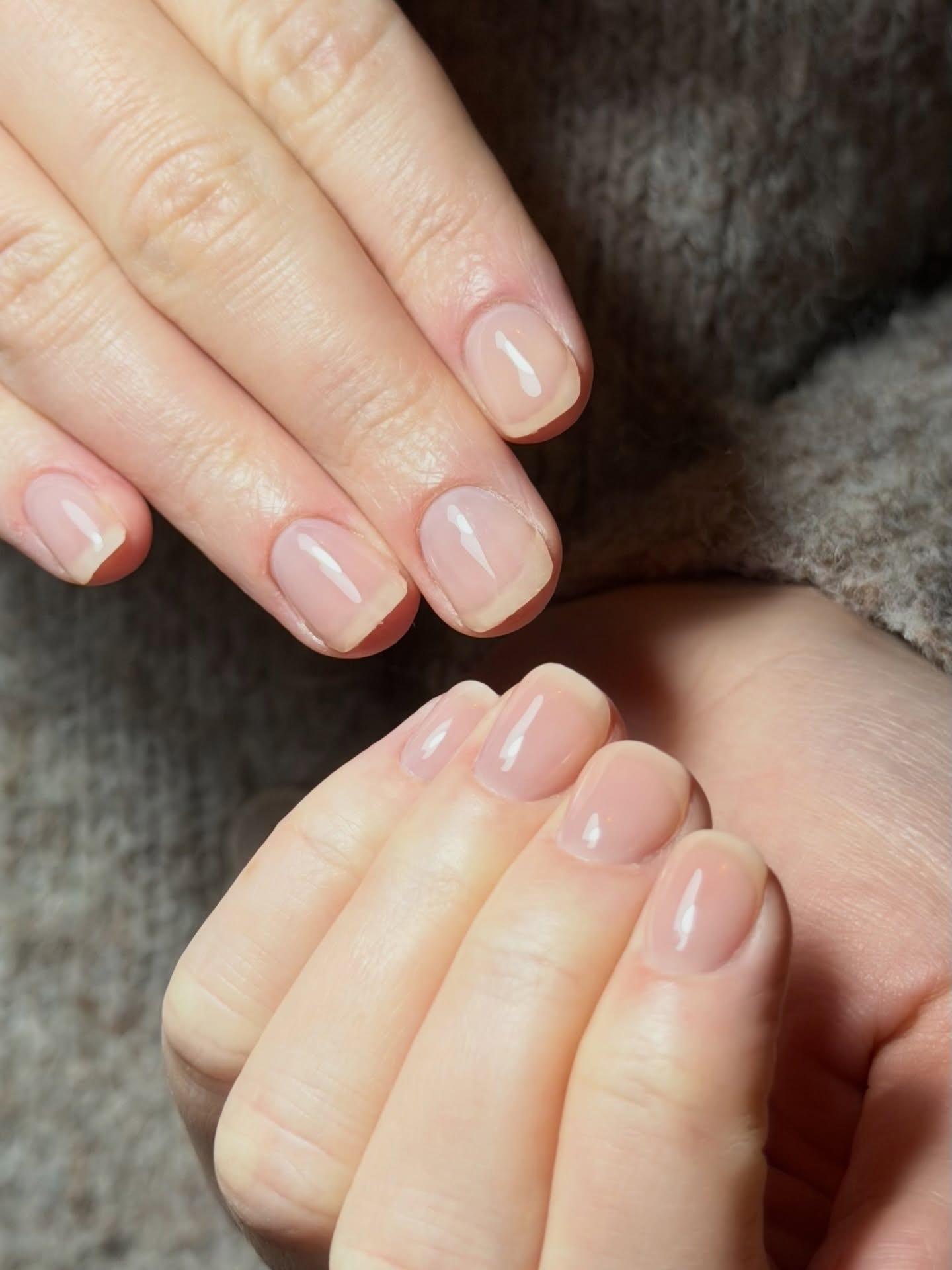 Sheer nude-pink gel manicure on short squoval nails