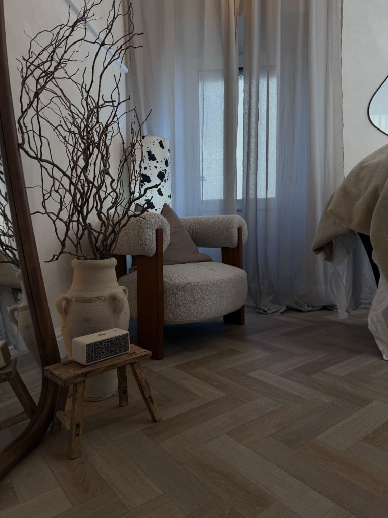 Waiting area with bouclé armchair